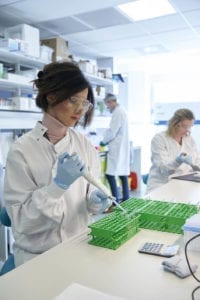 photo of scientists using pipette